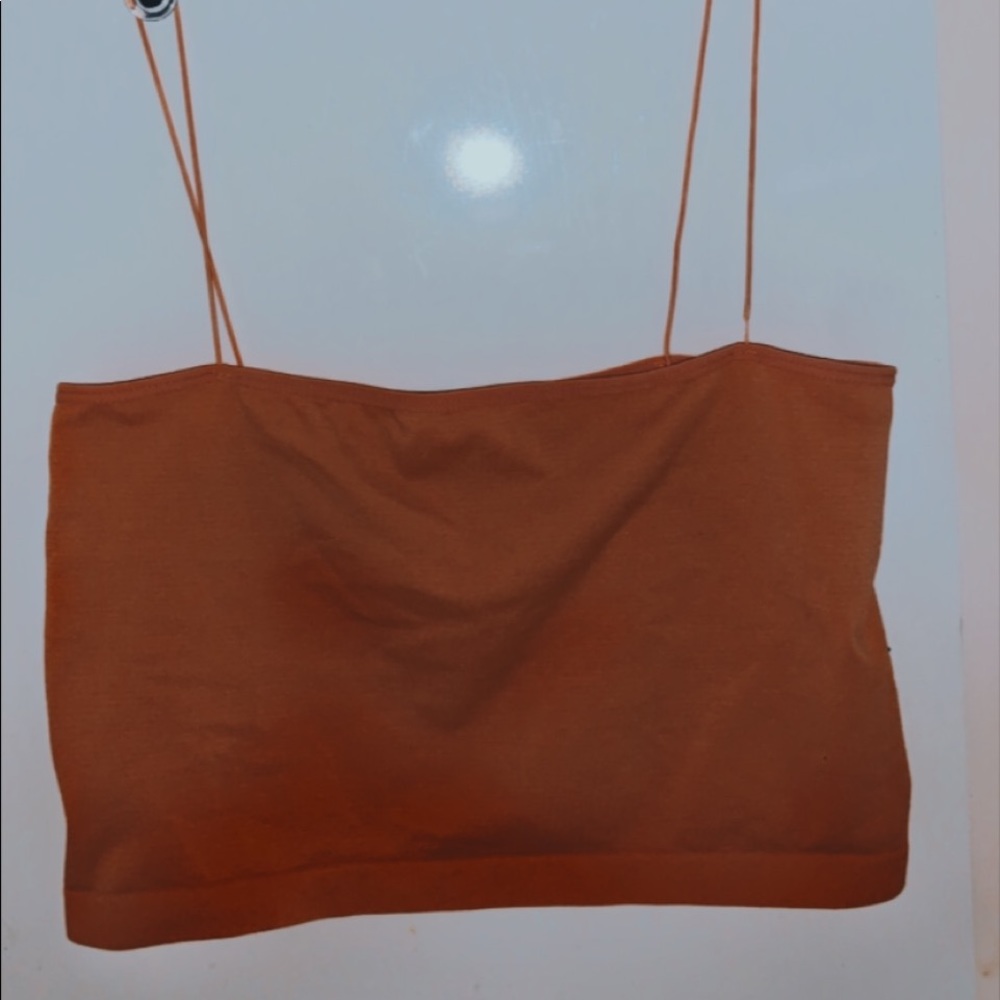 A super cute orangish pinkish crop tank top